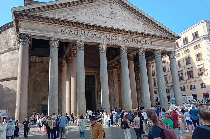 Visitors gathered under the granite columns of the Pantheon portico